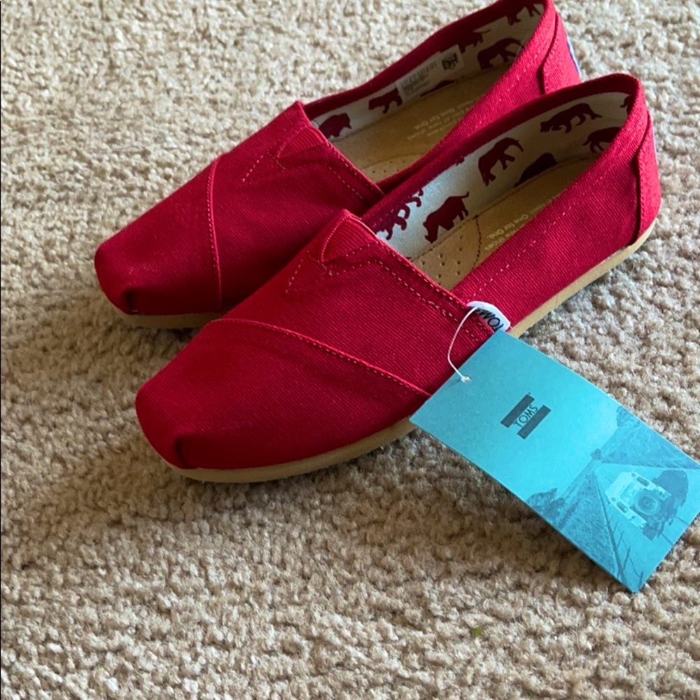 TOMS brand new red shoes...never been worn ..